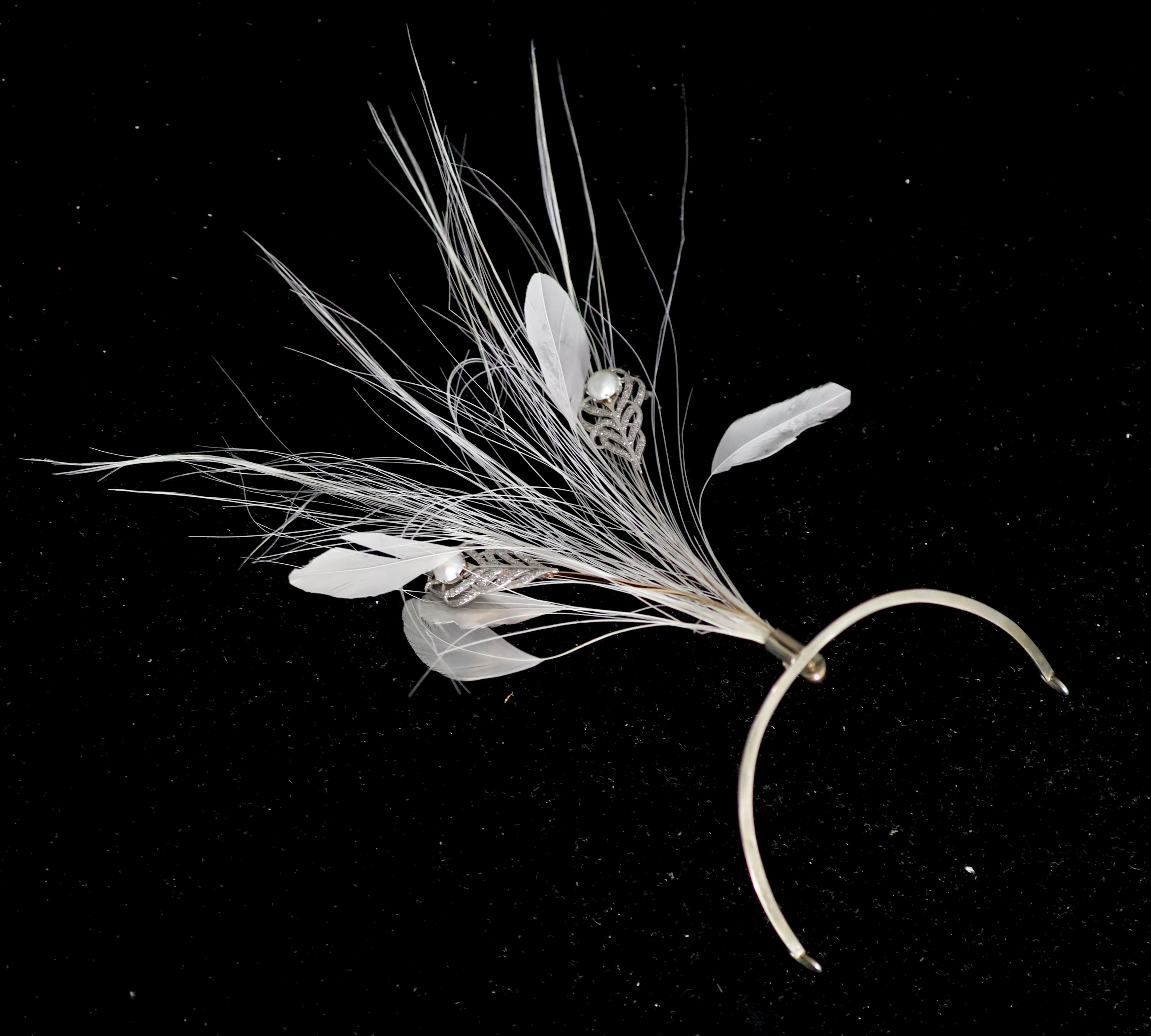 An early 20th century, continental gold and silver?, split pearl and diamond chip set aigrette, in later fitted case,